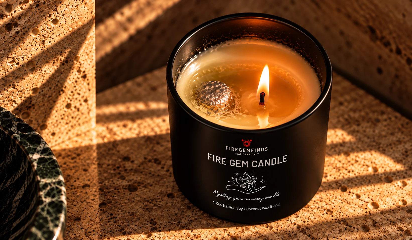 The foil-wrapped gem showing in the melted wax beside the flame