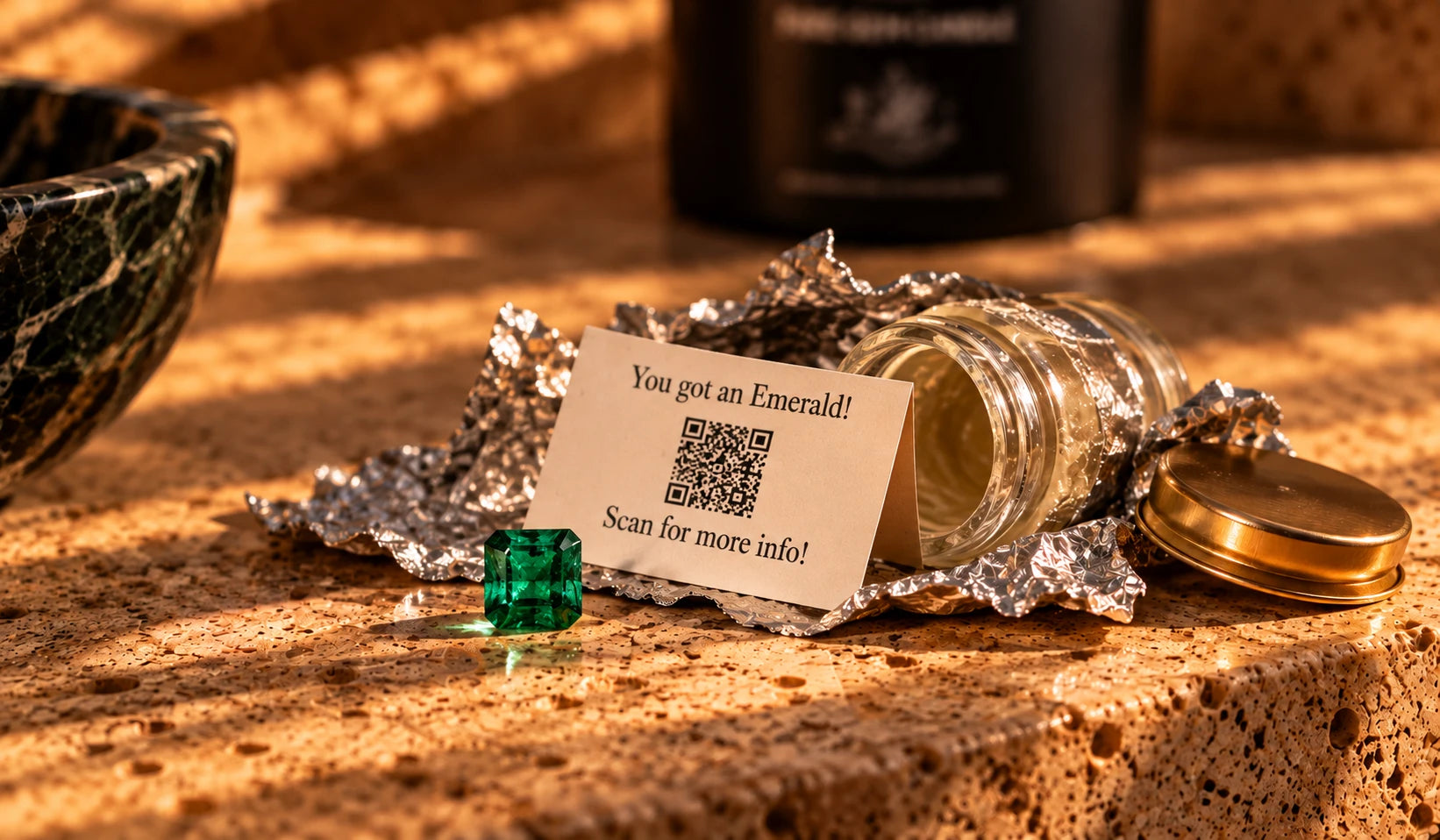 An emerald resting beside the opened jar and its card reading You got an Emerald, with a QR code