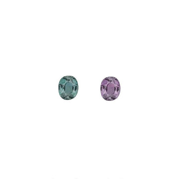 Oval alexandrite gemstones in green-blue and purple, two stones