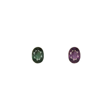 Faceted oval alexandrite gemstone showing green-to-purple color shift