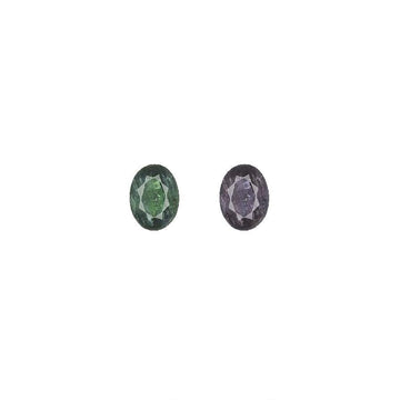 Oval alexandrite gemstone pair, one green and one purple
