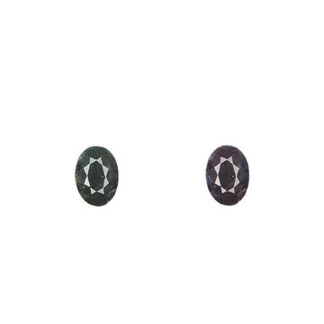 Oval alexandrite gemstones, dark green and dark purple in a pair