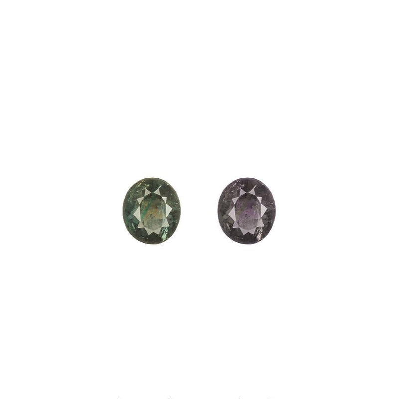 Two oval Alexandrite gemstones, green and reddish purple color shift