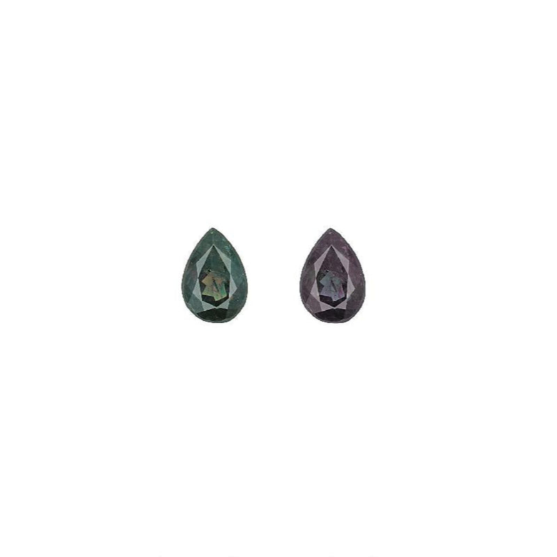 Pair of pear-cut alexandrite gemstones, one green and one purple