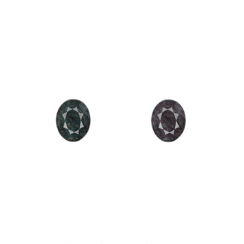 Oval alexandrite gemstone pair, dark green-purple with faceted oval cut