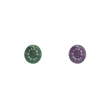 Alexandrite gemstone pair, round faceted stones in green and purple