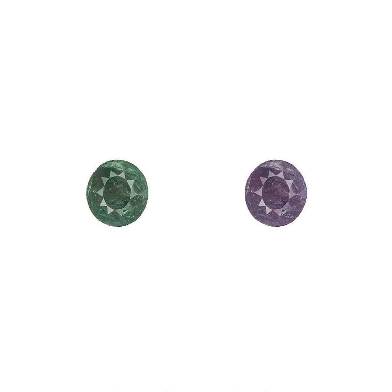 Alexandrite gemstone pair, round faceted stones in green and purple