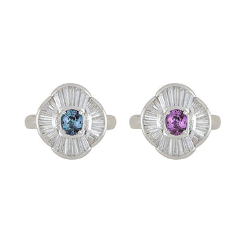 Platinum ring with round colored gemstone and radiant diamond halo, two-tone view