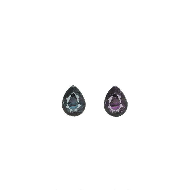 Pear-cut alexandrite gemstone pair, dark teal with purple faceted tones