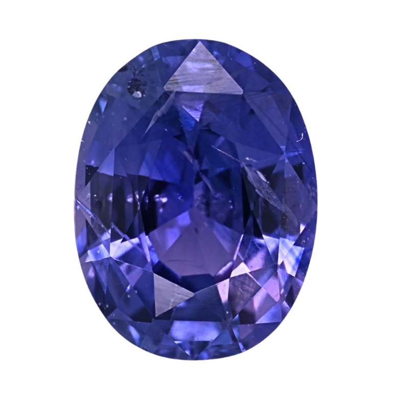 Oval violet sapphire gemstone, faceted dark blue-violet