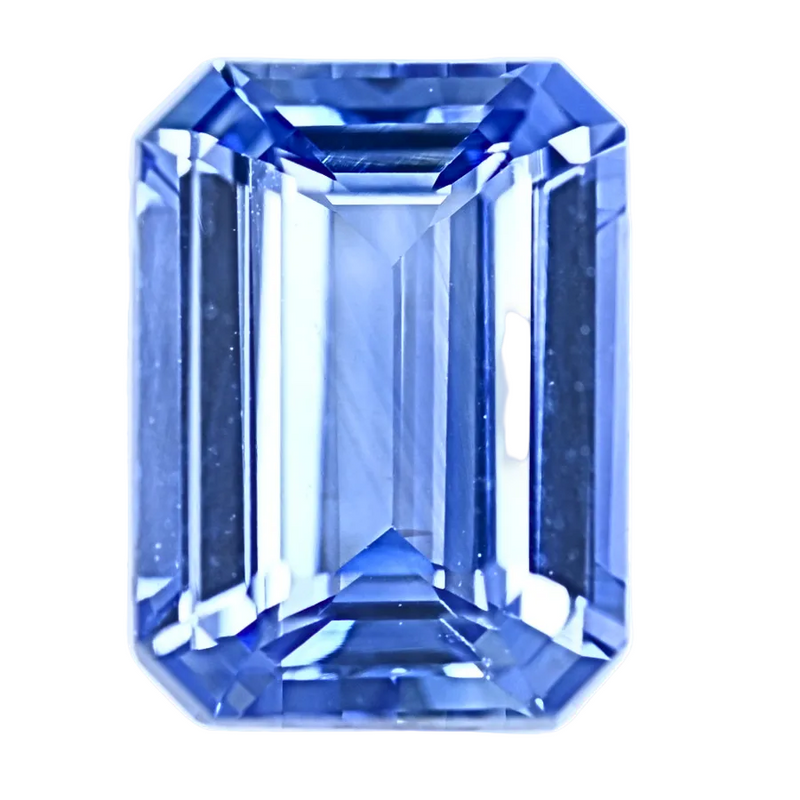 Blue sapphire gemstone in emerald-cut octagon with step facets, vivid blue
