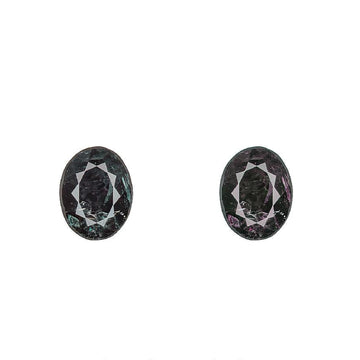 Oval alexandrite gemstones, dark greenish purple, faceted, two-stone pair