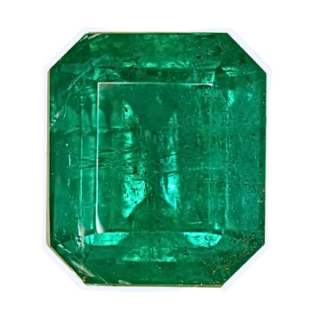 Emerald-cut green gemstone with stepped facets, rectangular octagon shape