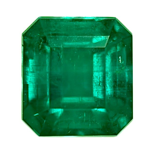 Emerald-cut green emerald gemstone with octagonal faceted, polished surface.