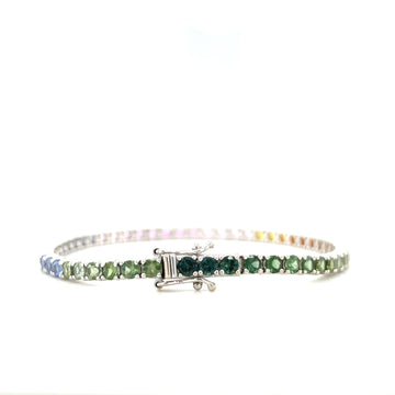 Silver-toned rainbow ombre sapphire bracelet with green center stone and box clasp