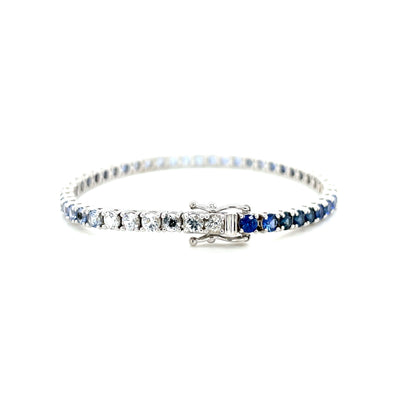 White metal sapphire tennis bracelet with blue gradient stones and engraved clasp