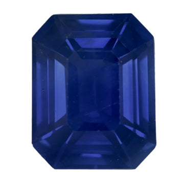 Close-up emerald-cut deep blue sapphire with step facets