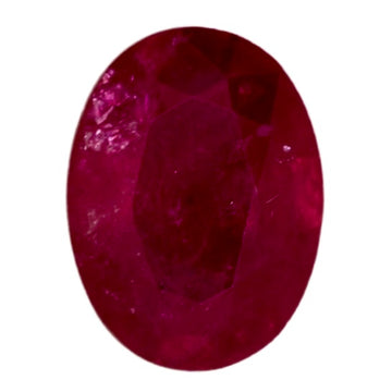 Oval ruby gemstone with deep red color and faceted surface