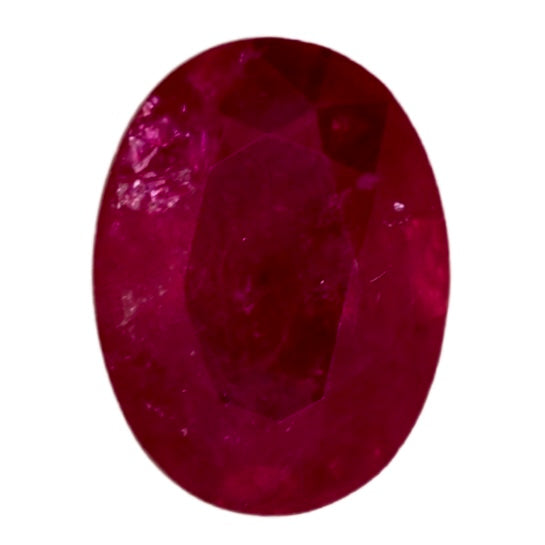 Oval ruby gemstone with deep red color and faceted surface