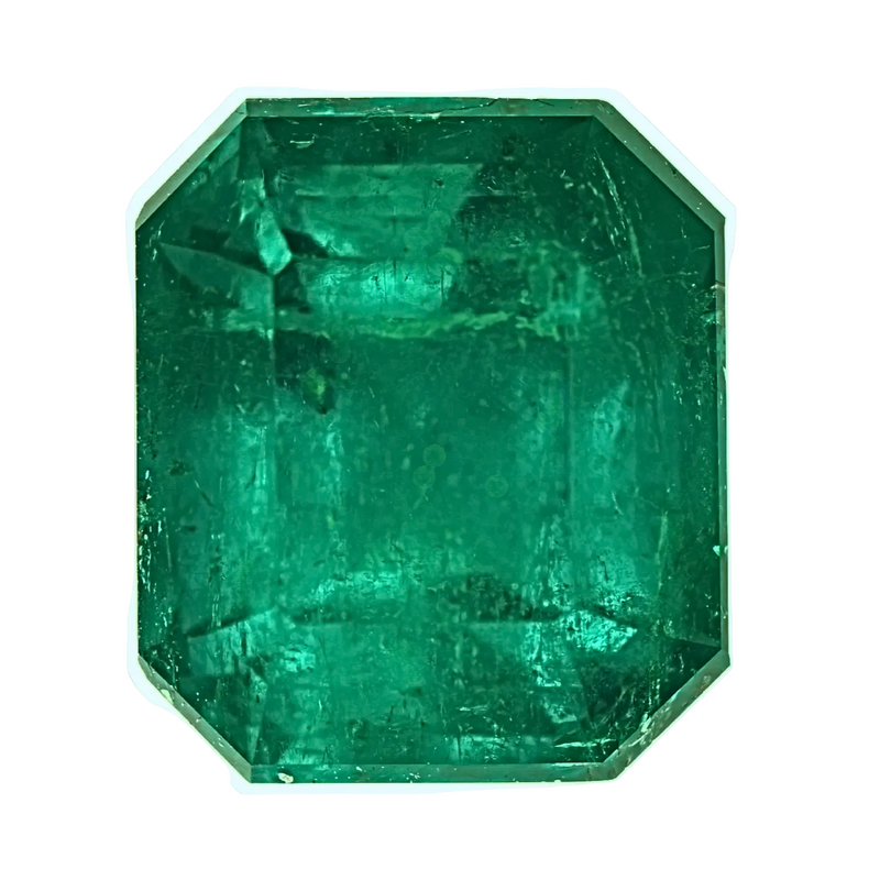 Octagonal emerald-cut emerald gemstone, deep green, faceted with polished edges