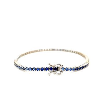 Blue sapphire ombre tennis bracelet with prong-set dark blue stones and clasp