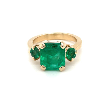 14k yellow gold emerald square-cut ring with green center stone and side emeralds
