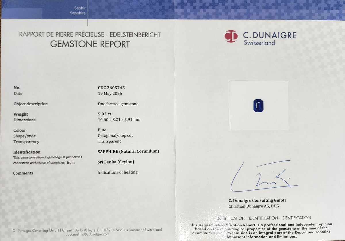 Gemstone report document for sapphire, with certification stamp and signature