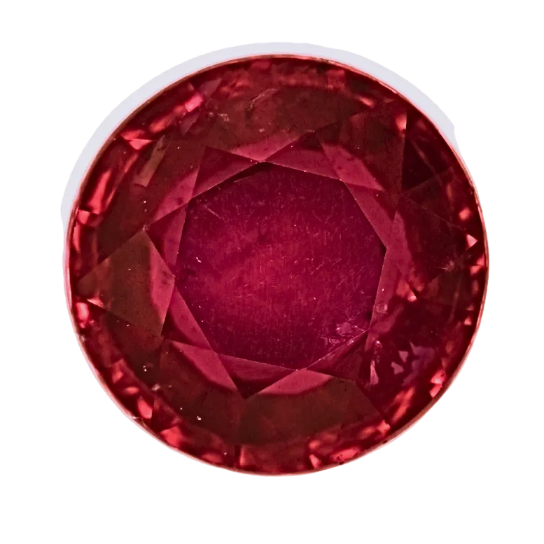 Round red ruby gemstone, faceted with bright sparkle, close-up view