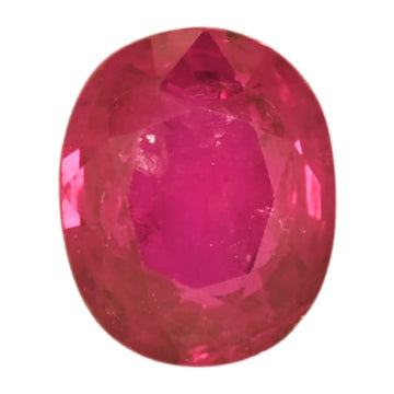 Oval faceted ruby gemstone in deep red