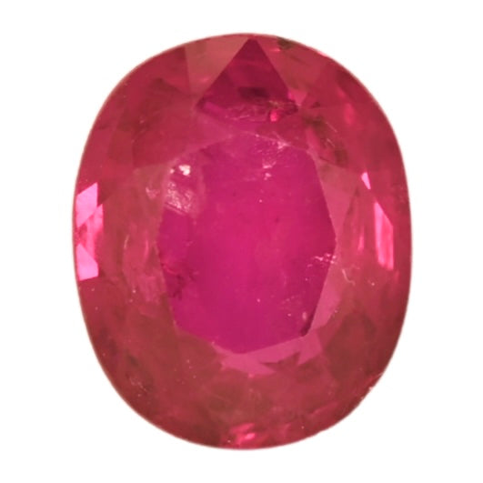 Oval faceted ruby gemstone in deep red