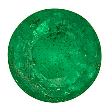 Green faceted emerald gemstone, oval cut with bright flashes