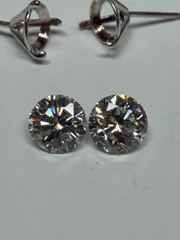 Natural diamond stud earrings with round brilliant stones in prong settings