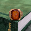 10k yellow gold signet ring with red oval intaglio showing profile engraving