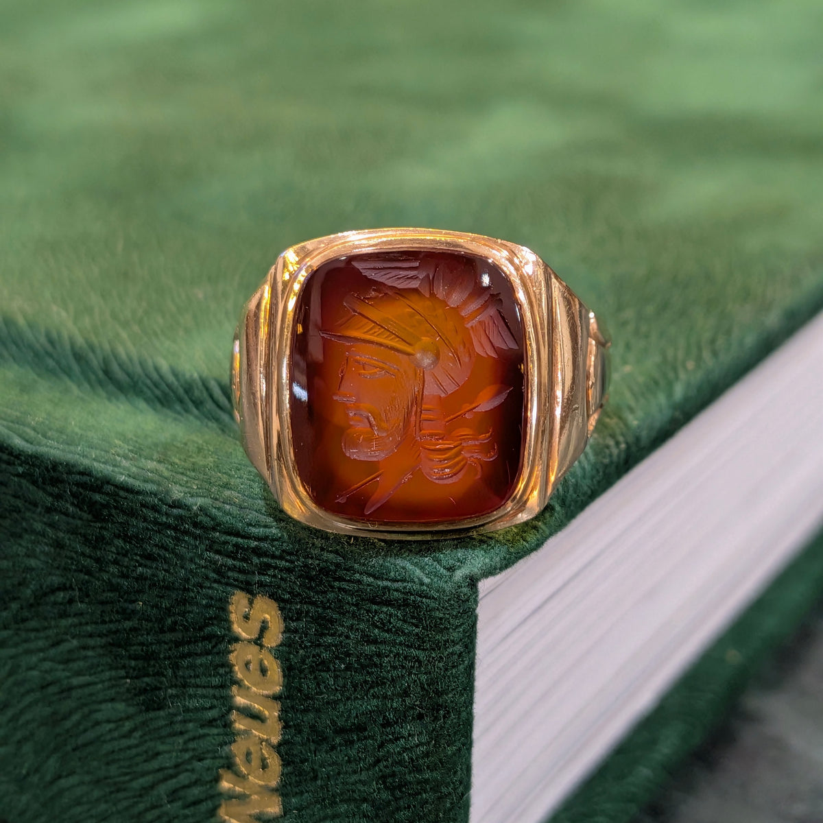 10k yellow gold signet ring with red oval intaglio showing profile engraving