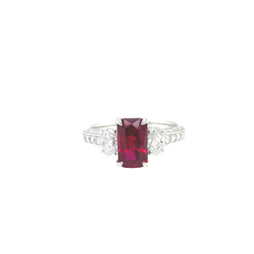 Platinum ring with cushion-cut deep red ruby center and diamond side accents