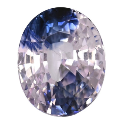 Oval bi-color sapphire gemstone, light purple and blue with faceted sparkle