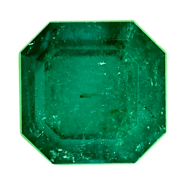 Octagon-cut green emerald gemstone, faceted and glossy