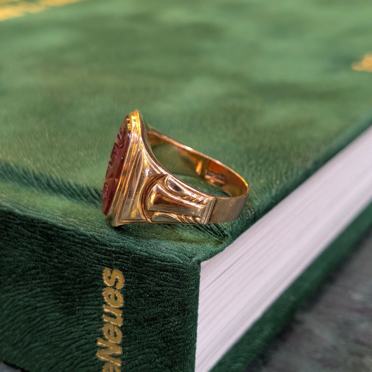 10k yellow gold signet ring with red oval intaglio, wide engraved shank