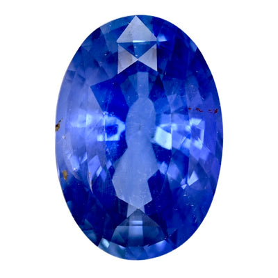 Oval blue sapphire gemstone, faceted, polished surface