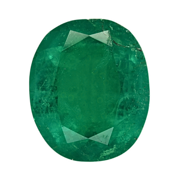 Close-up oval emerald gemstone showing deep green facets and inclusions