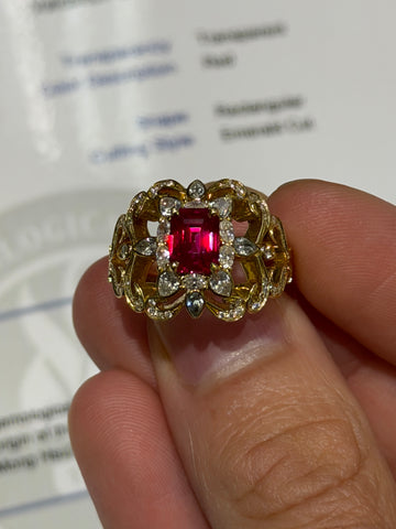 Gold-toned ring with red square ruby center and round clear stones, halo setting