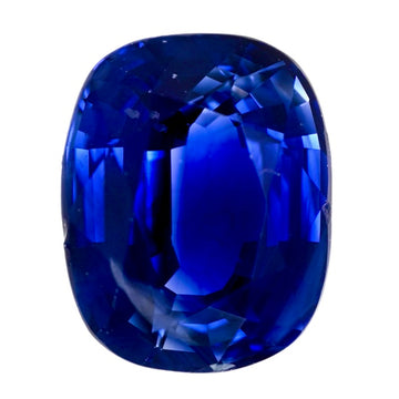 Oval-cut blue sapphire gemstone, deep royal blue with faceted sparkle.