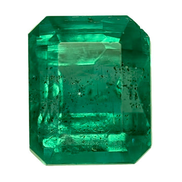 Emerald-cut green gemstone with rectangular step facets
