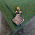 Two-tone gold square diamond pendant with large clustered diamonds and hinged bail top.