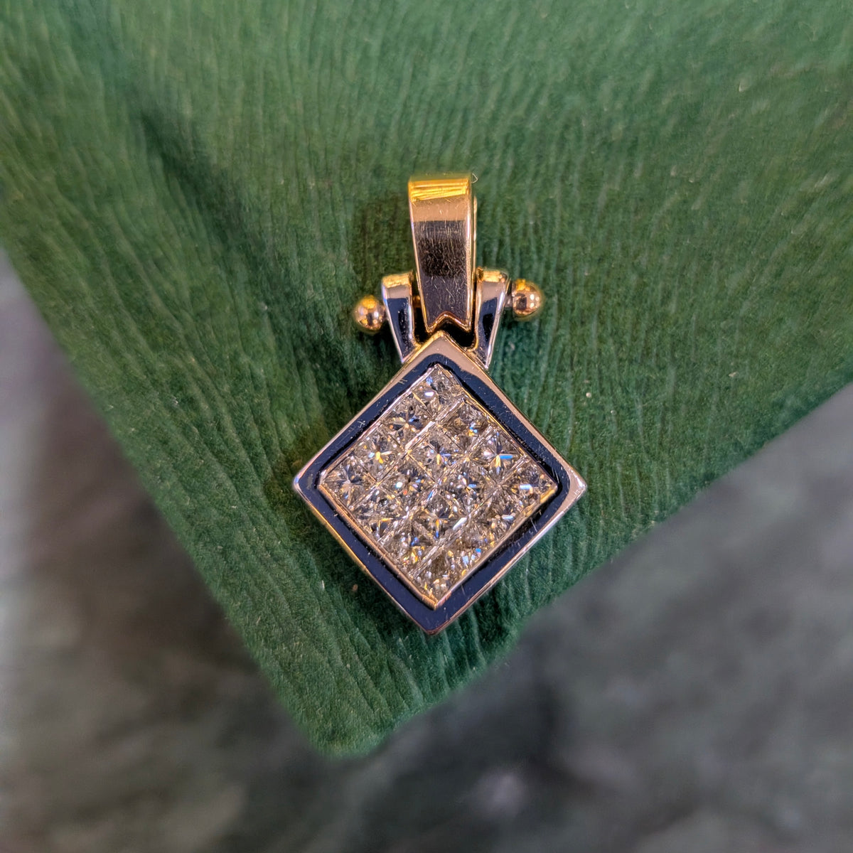 Two-tone gold square diamond pendant with large clustered diamonds and hinged bail top.