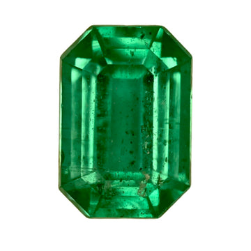 Emerald-cut green gemstone with octagonal step facets, faceted prismatic look