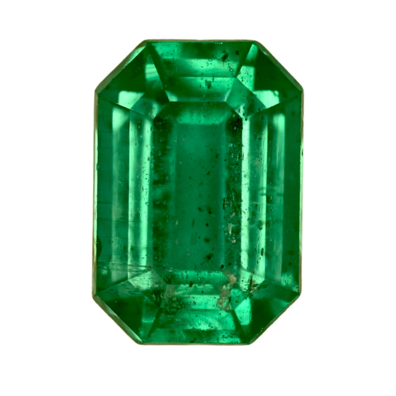 Emerald-cut green gemstone with octagonal step facets, faceted prismatic look