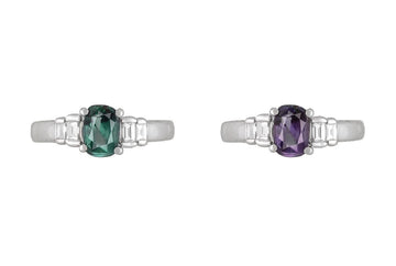 Platinum alexandrite and diamond ring, oval green center with baguette diamond details