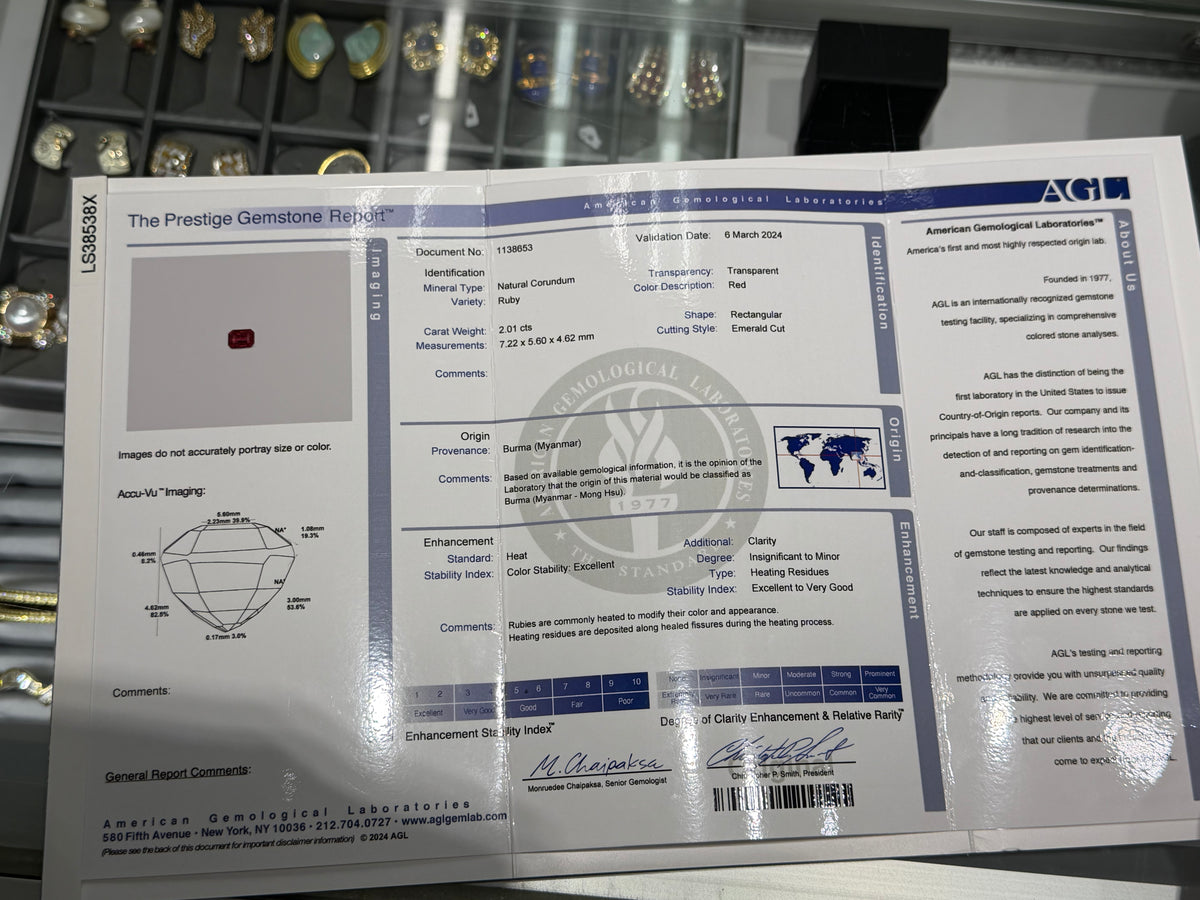 Gemstone report document with ruby ring details and security stamps
