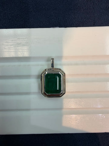 Silver pendant with green gemstone in octagonal bezel, top bail